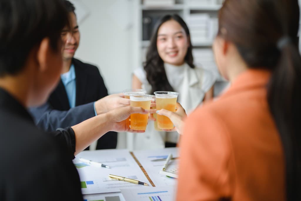 Business professionals discussing beverages